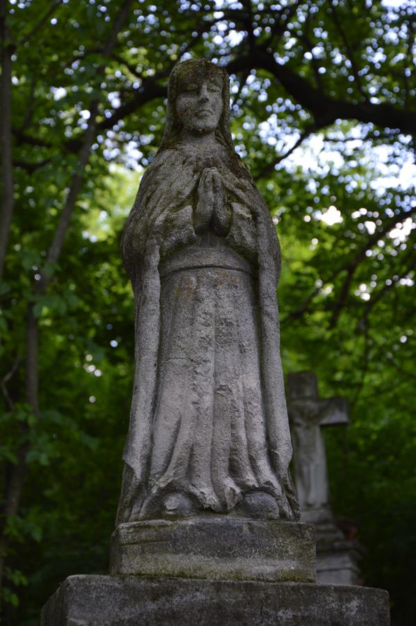 Figure from the gravestone of Catherine Grela. Cemetery in Kokutkovce