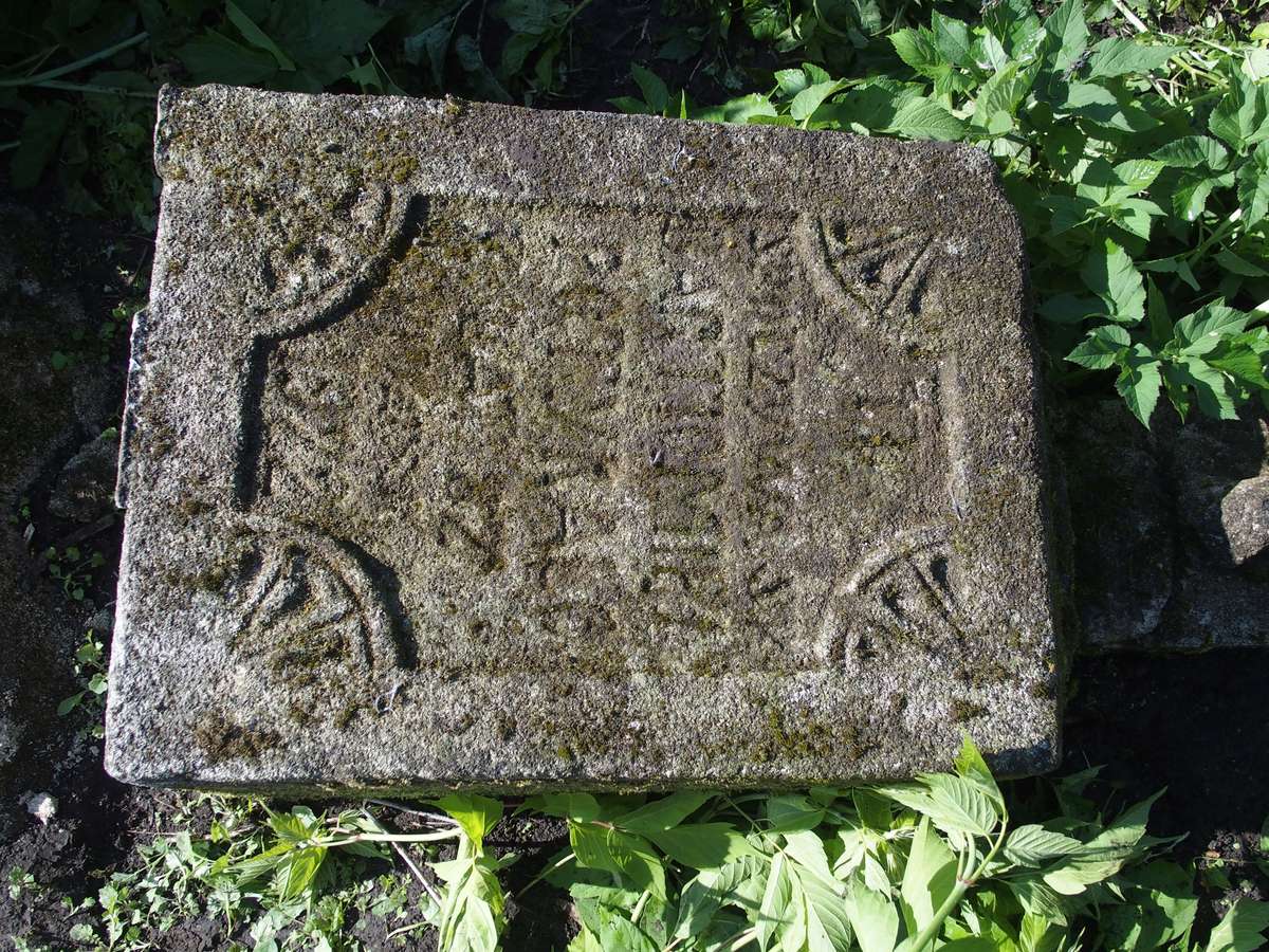 Fragment of a gravestone of Bartłomiej Potyrała. Cemetery in Cebrów