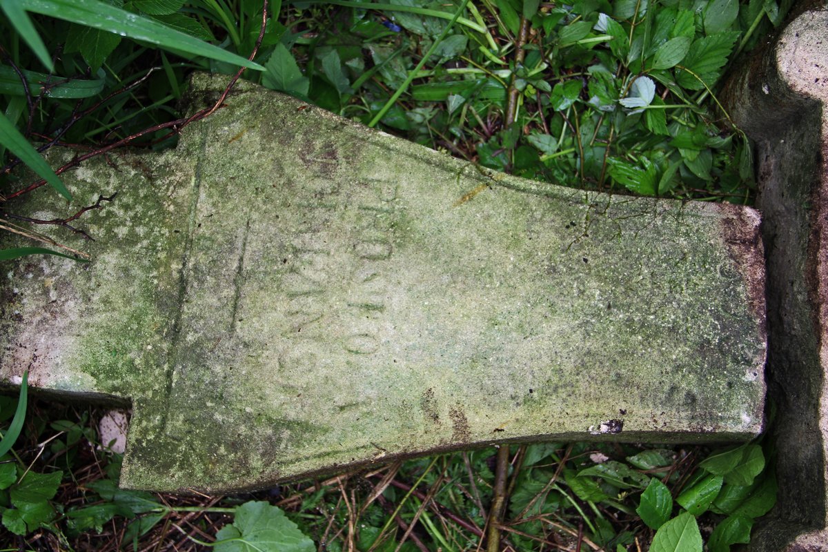 Part of a broken cross from the gravestone of Marcin Dubieli, cemetery in Oprylovce