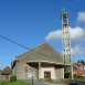 Fotografia przedstawiająca Płaskorzeźba Jana Lamberta-Ruckiego na fasadzie kościoła Saint-Germain w Fiefs