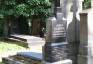 Fotografia przedstawiająca Tombstone and plaque in memory of Prof. Marian Szyjkowski in Prague