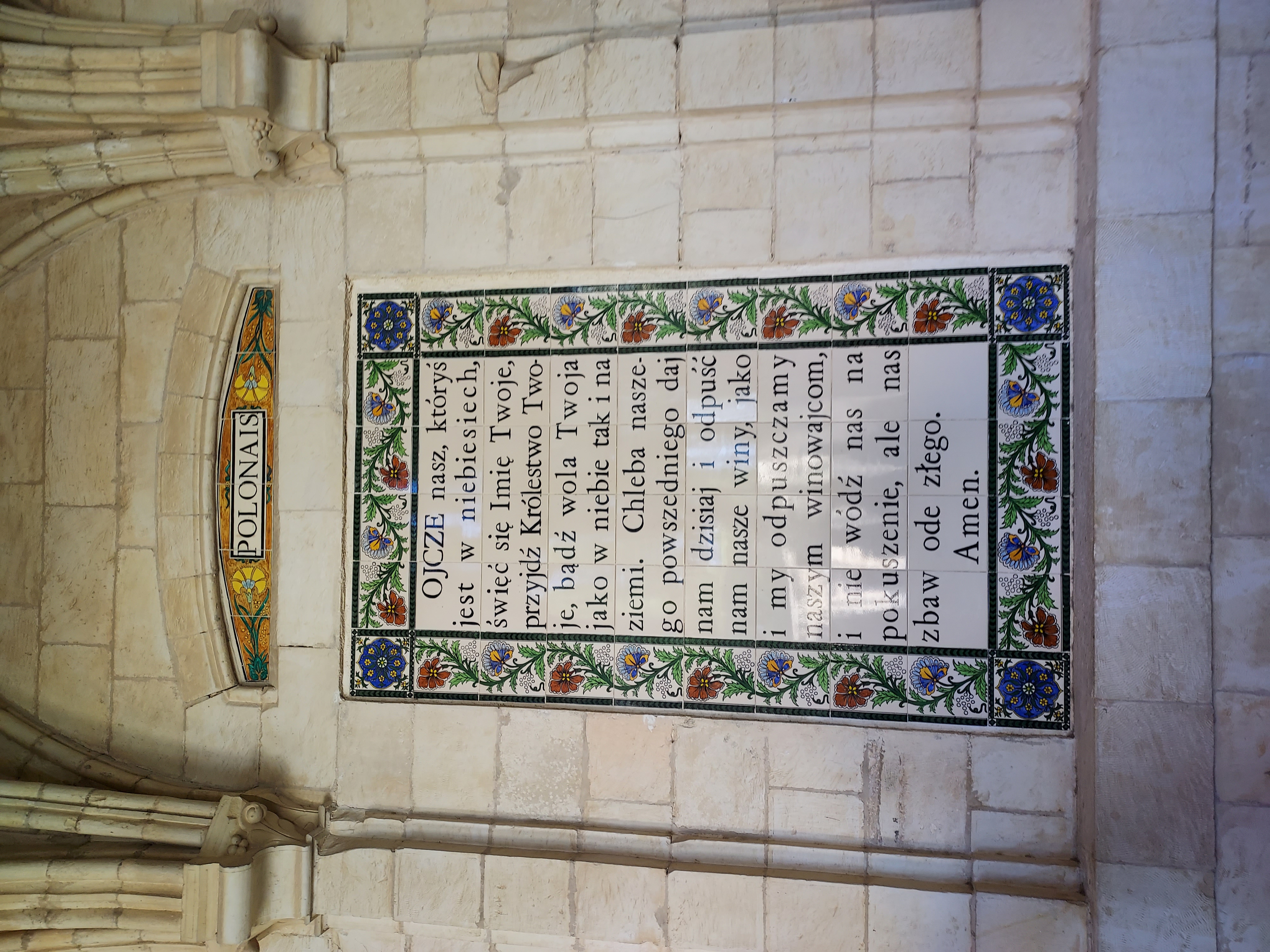 Fotografia przedstawiająca Plaque with the text of the \"Our Father\" prayer in the Pater Noster church in Jerusalem