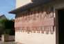 Photo montrant Bas-reliefs by Jean Lambert-Rucki on the façade of the Saint-Lazare church in Lèves