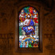 Fotografia przedstawiająca Stained glass window \"Christ the Judge\" by Józef Mehoffer in the Saint-Martin church in Onnens