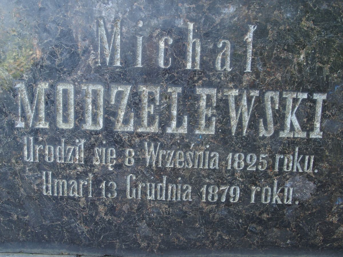 Fragment of the gravestone of Mikhail Modzelewski, with visible inscription,Baykova cemetery in Kiev, as of 2021.