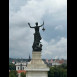 Fotografia przedstawiająca \"Elektra\" - sculpture by Boleslaw Balzukevich on the roof of the power station in Vilnius