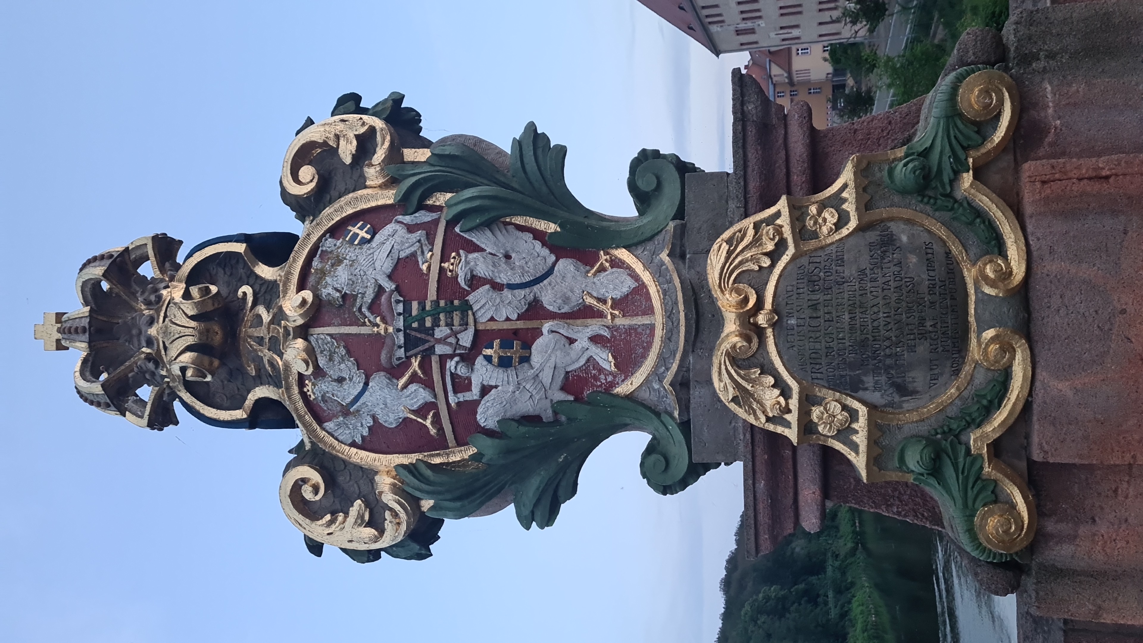 Fotografia przedstawiająca Coat of arms of the Polish-Lithuanian Commonwealth on the Pöppelmann Bridge in Grimm