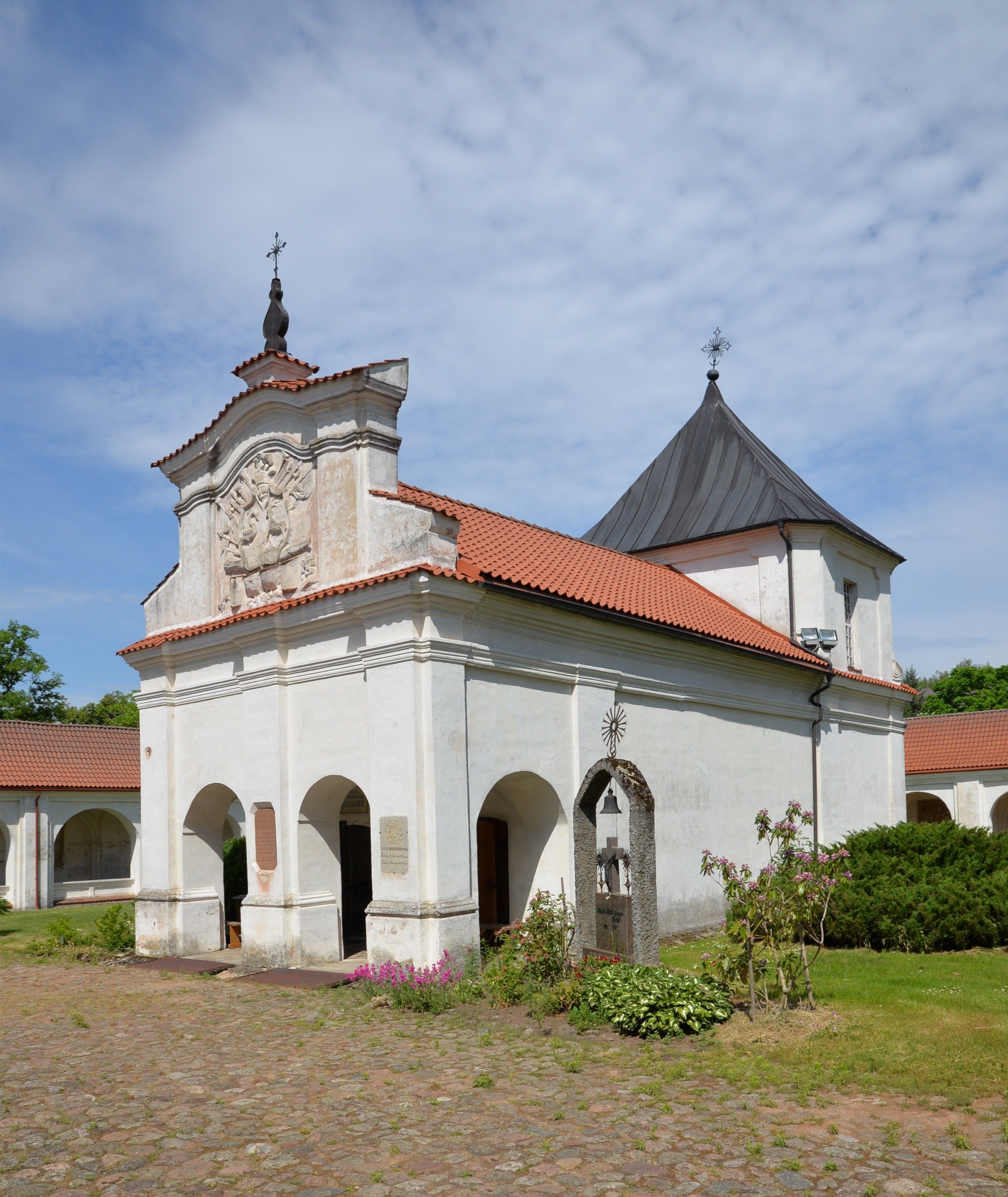 The Chapel of the Holy Stairs in Cytowiany, part of the Bernardine church and monastery complex. The white building with a red-tiled roof features arches and a decorative facade.