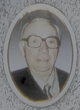 Portrait of a man with glasses in an oval frame on a textured background.
