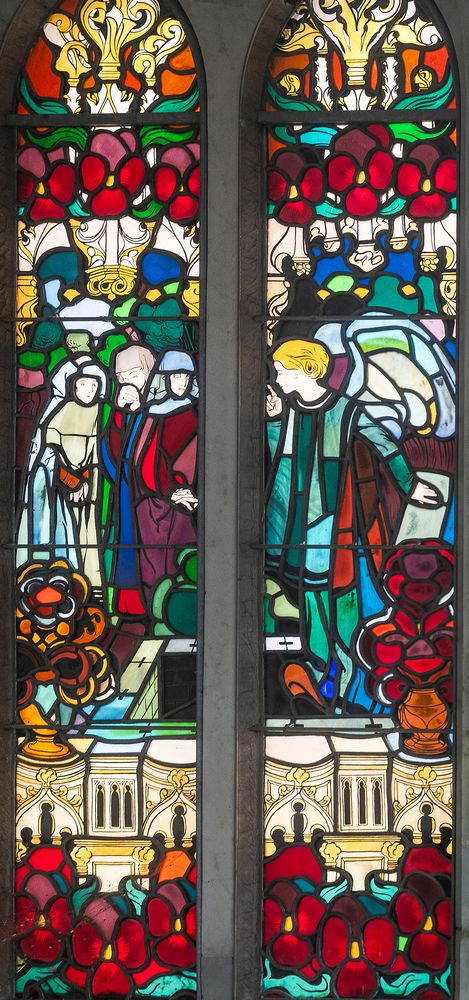 Jozef Mehoffer's stained glass window in the Grauer family chapel in Opava, depicting figures in colourful robes surrounded by floral motifs and complex architectural elements.