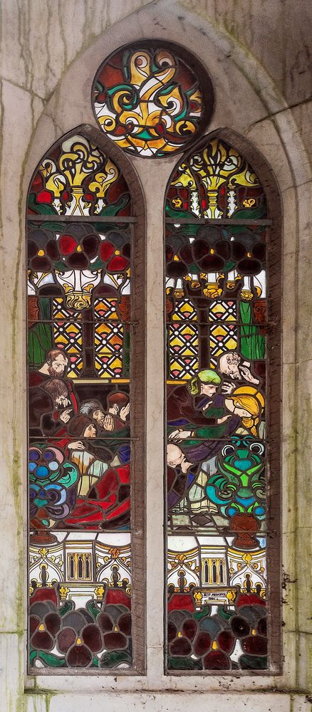 Jozef Mehoffer's stained glass windows in the Grauer family chapel in Opava, composed of intricate designs with figures and floral motifs in vivid colours, set in pointed frames.