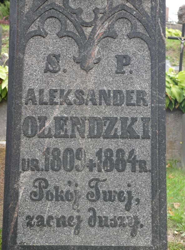 Inskrypcja nagrobka Aleksandra Olendzkiego, cmentarz na Rossie, stan z 2015 roku
