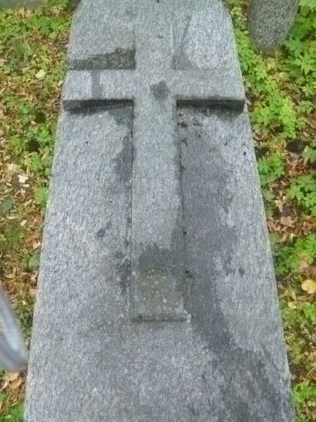 Fragment of a tombstone of Alexander Pok, Na Rossie cemetery in Vilnius, state of 2013