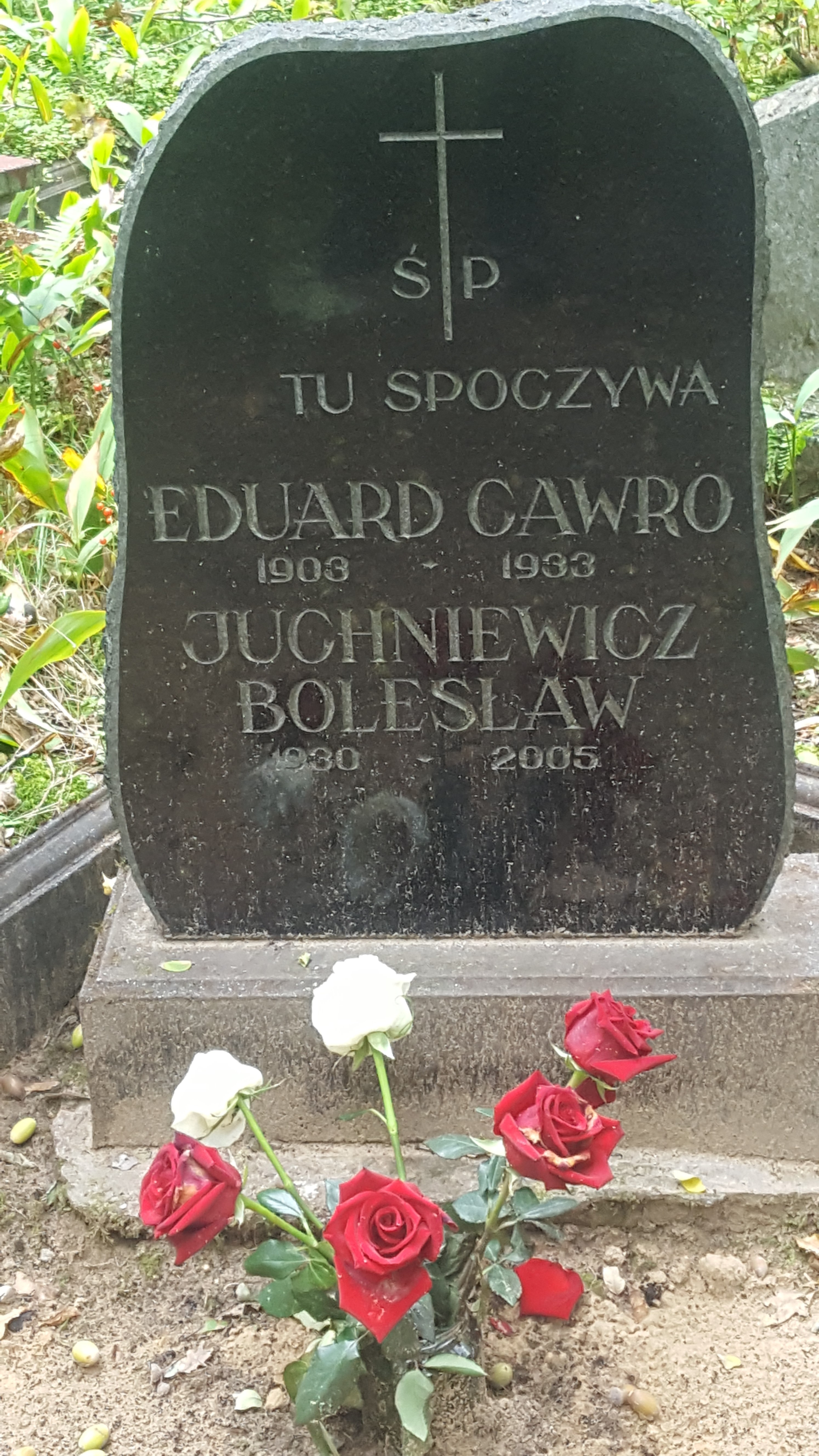 Inscription from the tombstone of Eduard Gawro and Boleslav Yuchnevich, St Michael's cemetery in Riga, as of 2021.