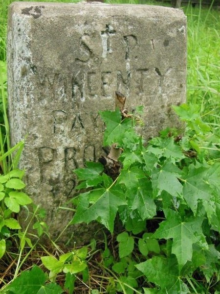 A fragment of the gravestone of Wincenty Prostak, Ross Cemetery in Vilnius, as of 2013