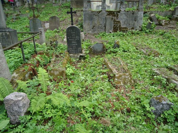 Tombstones enclosed by a common fence, Ross Cemetery in Vilnius, as of 2013