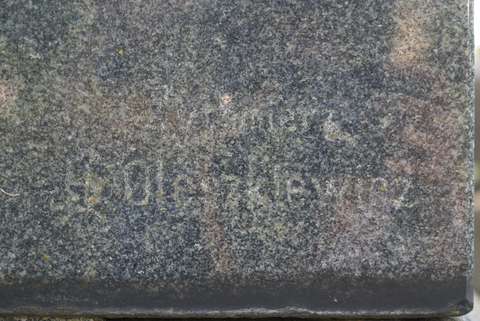 Signature from the tombstone of Alexander, Izabella and Marcela Budryk, Ross Cemetery in Vilnius, as of 2013.