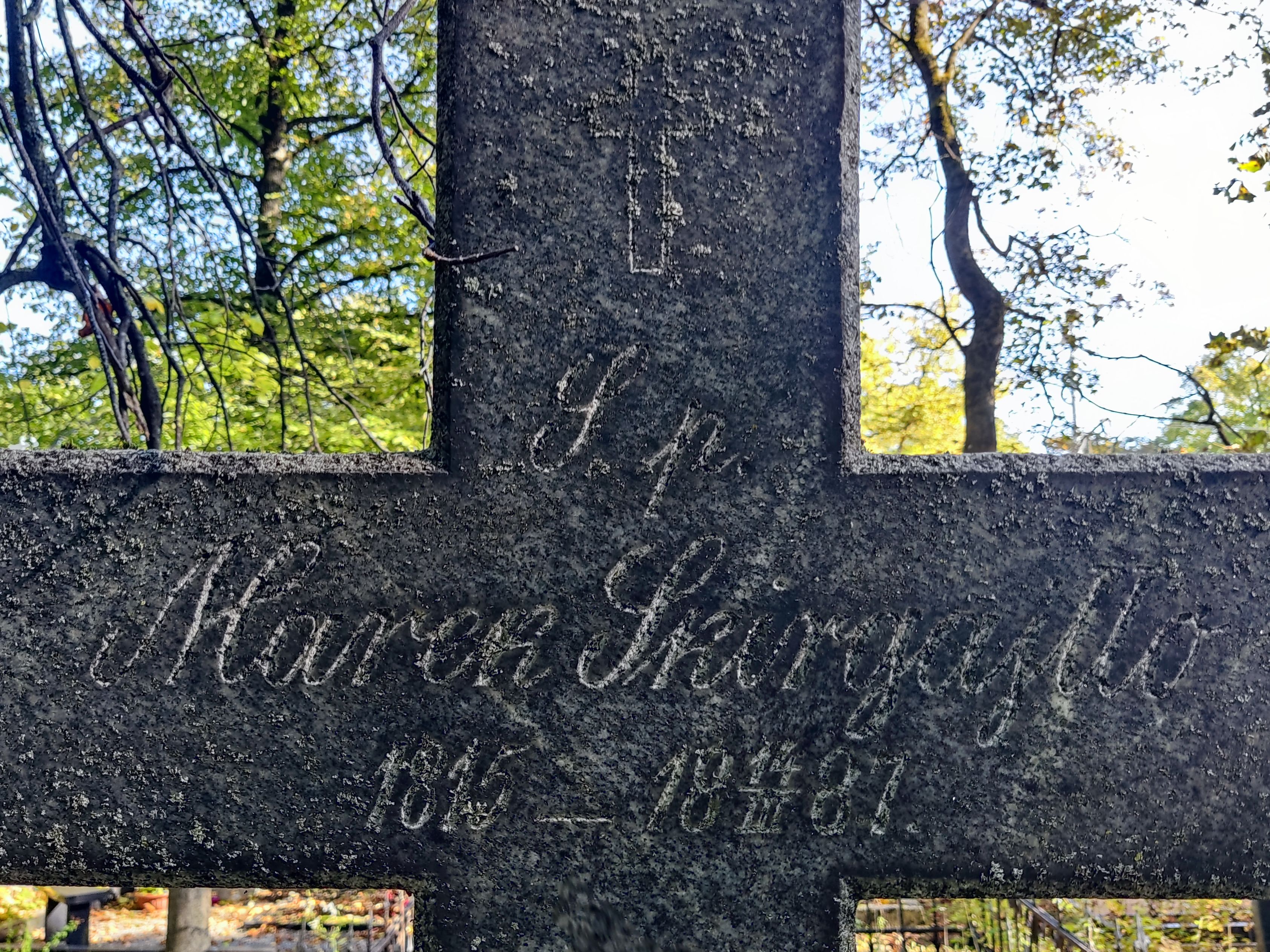 Inscription on the gravestone of Mark Skirgaylo at St Michael's Cemetery in Riga, as of 2022.