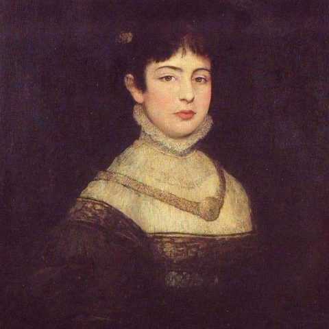 Portret młodej kobiety z ciemnymi włosami, w sukni z wysokim kołnierzem i złotą ozdobą, na ciemnym tle. Jej twarz jest dobrze oświetlona, patrzy prosto na widza.