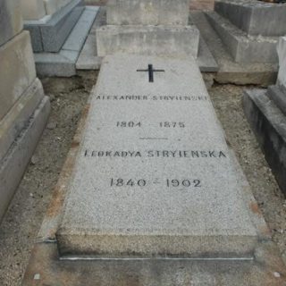 Gravestone of Alexander and Leokadya Stryjenski at Les Champeaux Cemetery in Montmorency, France. The stone is rectangular with engraved names and dates: Alexander Stryjenski 1804-1875, Leokadya Stryjenska 1840-1902.