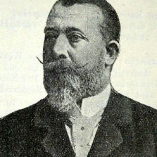 A portrait of Julian Niedzielski, a Polish architect known for his work in Vienna during the Historicism period. He has a beard and is wearing a suit.