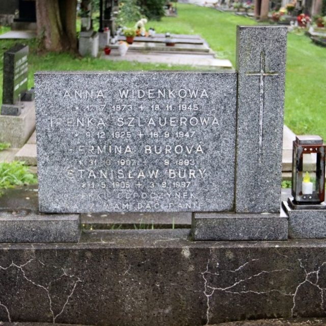 Gravestone of Anna Widenkowa, Irena Szlauerowa, Hermina Burova, and Stanisław Bury. The stone features a cross and inscriptions with names and dates. A candle in a glass holder is on the right.