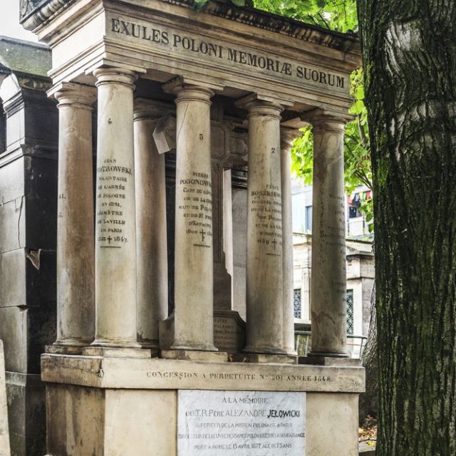 Collective grave 'Exules Poloni Memoriae Suorum' at Montmartre Cemetery in Paris. The tomb resembles an ancient temple with a Latin cross under a canopy, decorated with an eagle and inscriptions of the deceased.