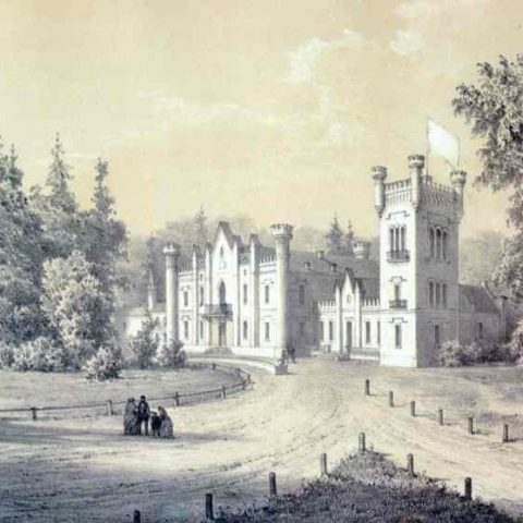 A 19th-century illustration depicting the neo-Gothic palace in Wojtkuszki, with crenellated towers and a central building. A dirt track, lined with trees, leads to the entrance, with a group of people in the foreground.