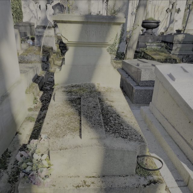 Tombstone of the Riguelle family and Edward Mirenowicz with stepped plinth and cross. Inscription on the jardiniere. Located in the cemetery with surrounding graves.