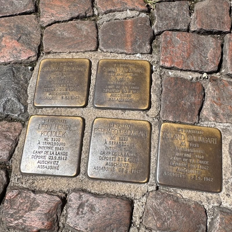 Stolpersteine on the pavement at 4 Place Saint-Pierre in Bordeaux commemorating the Baumgart family: Abraham, Chana, Bernard and Roland, victims of Auschwitz.